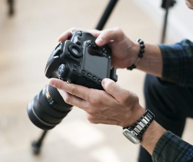 A man checking camera record