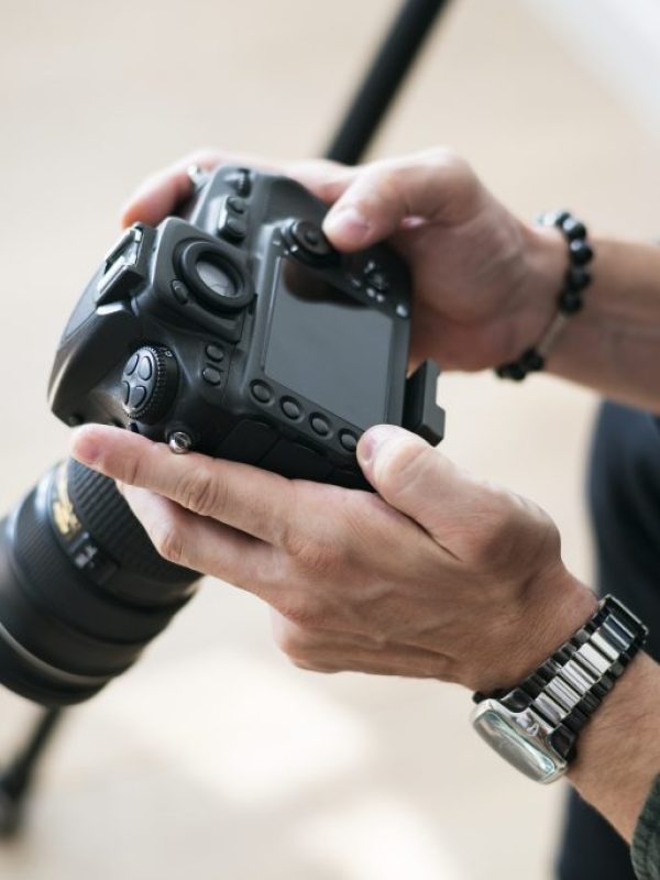 A man checking camera record